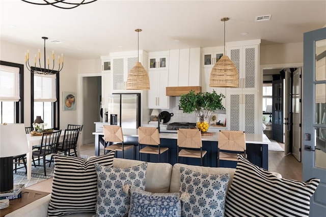 interior space featuring wood-type flooring and an inviting chandelier