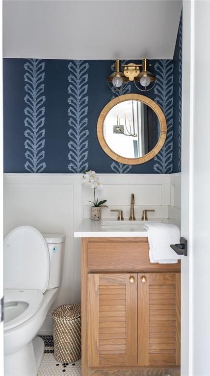 bathroom with tile patterned floors, vanity, and toilet