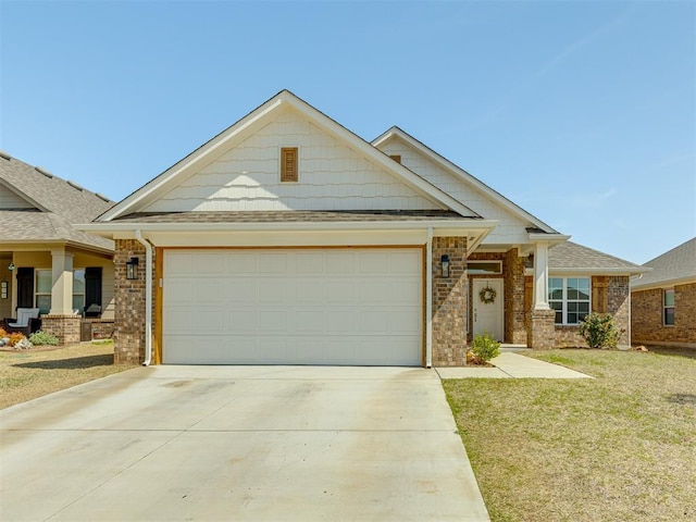 view of front of house with a garage and a front lawn