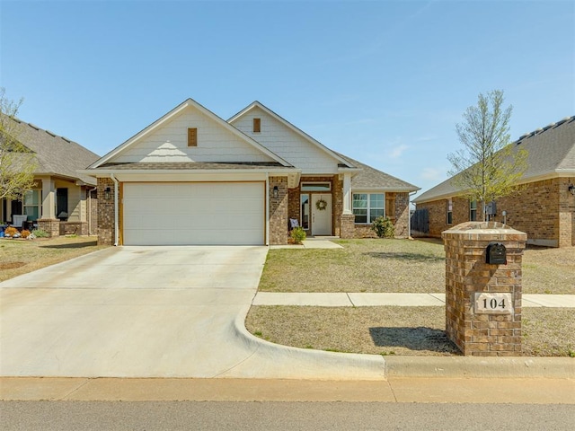 view of front of home featuring a garage and a front lawn