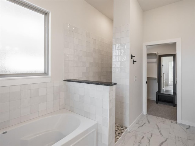 bathroom with separate shower and tub