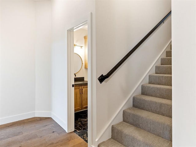 stairway featuring hardwood / wood-style floors