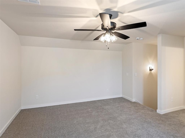 carpeted spare room with ceiling fan