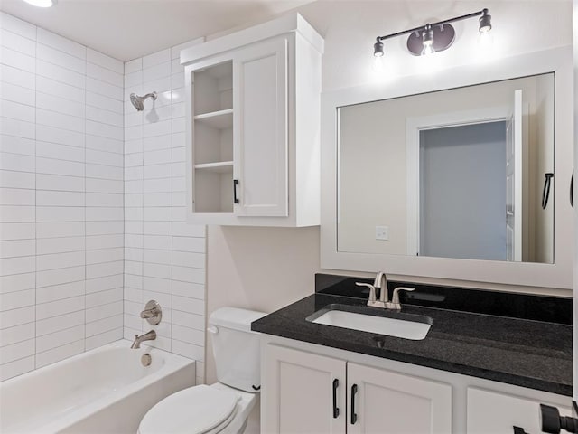 full bathroom with vanity, toilet, and tiled shower / bath combo