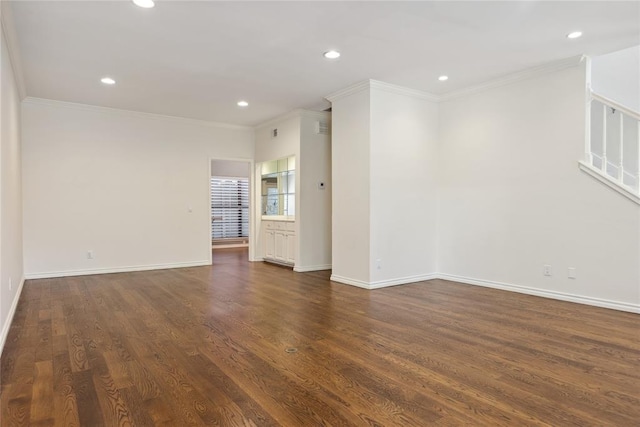 unfurnished room featuring dark hardwood / wood-style floors and ornamental molding