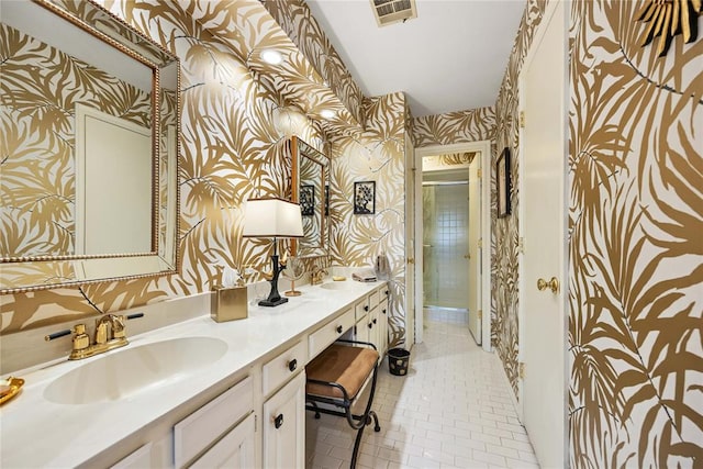 bathroom featuring tile patterned flooring and vanity