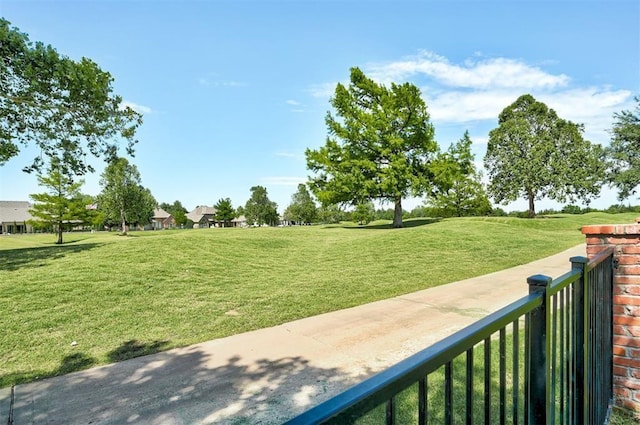 view of property's community featuring a lawn