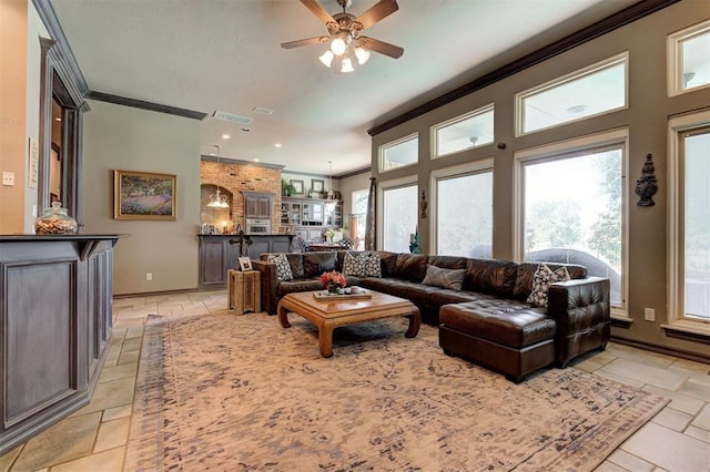 living room featuring ceiling fan and ornamental molding