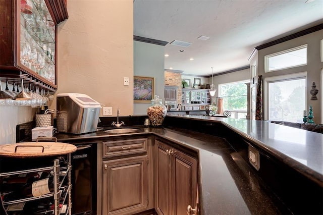 kitchen with sink and ornamental molding