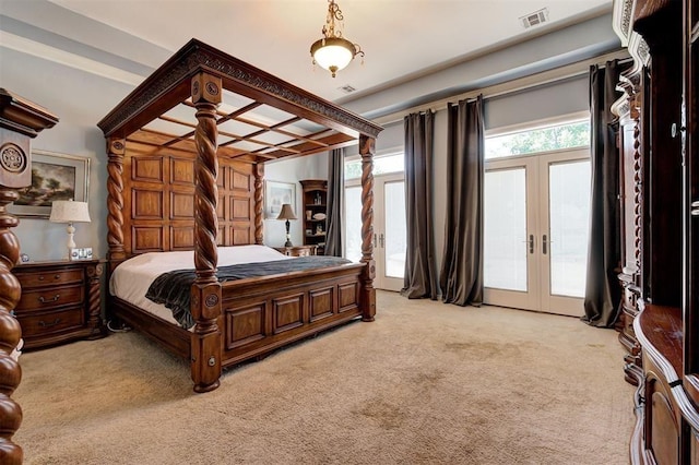 carpeted bedroom with access to exterior and french doors