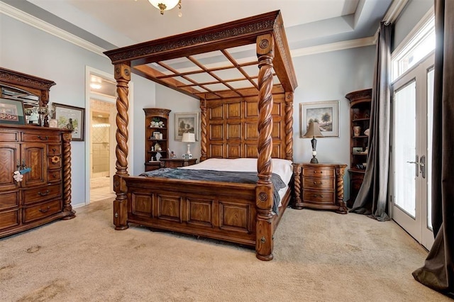 carpeted bedroom featuring ensuite bathroom and crown molding