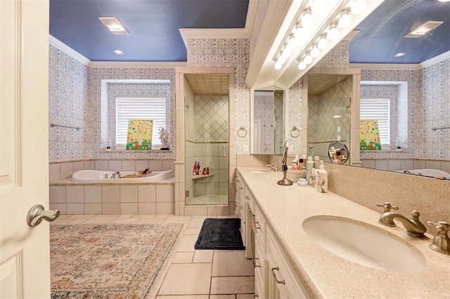 bathroom featuring tile patterned flooring, vanity, crown molding, and independent shower and bath