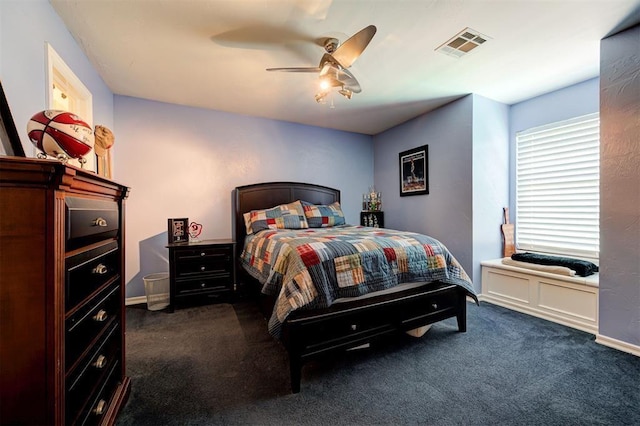 bedroom with dark colored carpet and ceiling fan