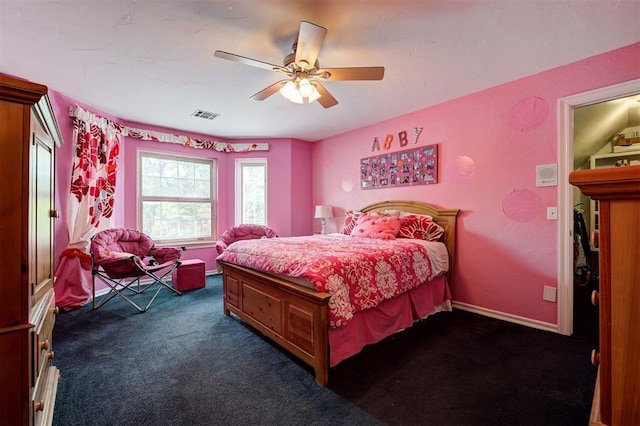 bedroom with dark colored carpet and ceiling fan