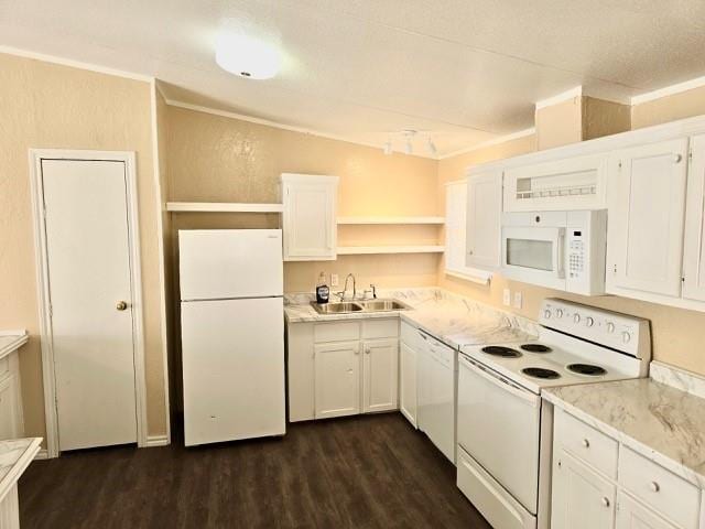 kitchen with dark hardwood / wood-style flooring, ornamental molding, white appliances, sink, and white cabinetry