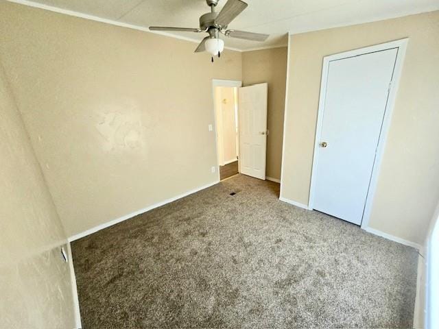 unfurnished bedroom featuring carpet flooring and ceiling fan