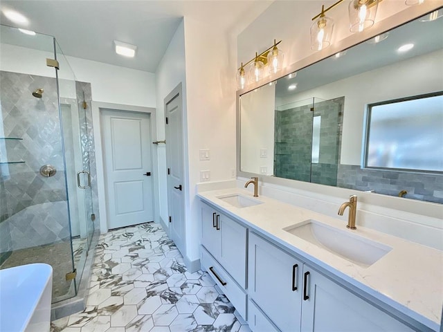 bathroom featuring vanity and independent shower and bath