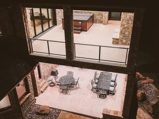 view of patio featuring a jacuzzi