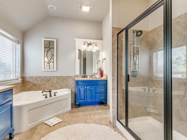 bathroom featuring tile patterned floors, plus walk in shower, and lofted ceiling