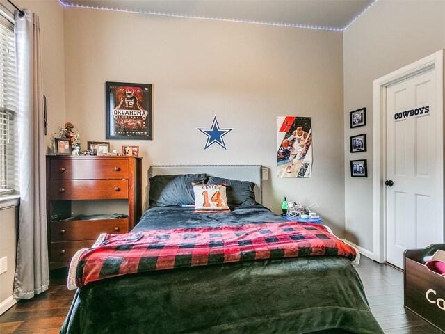 bedroom featuring dark wood-type flooring