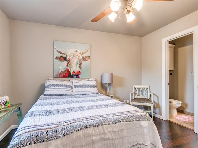 bedroom with ensuite bath, ceiling fan, and dark hardwood / wood-style flooring