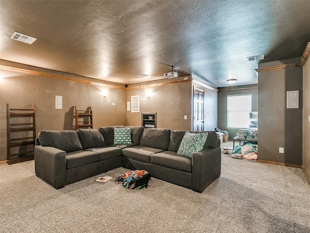 carpeted living room featuring a textured ceiling and ornamental molding