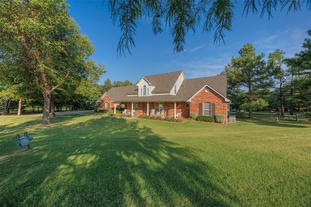 new england style home with a front lawn