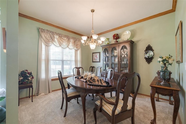 carpeted dining area featuring ornamental molding and a chandelier