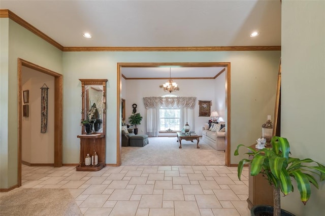 entryway featuring crown molding, light colored carpet, and a notable chandelier