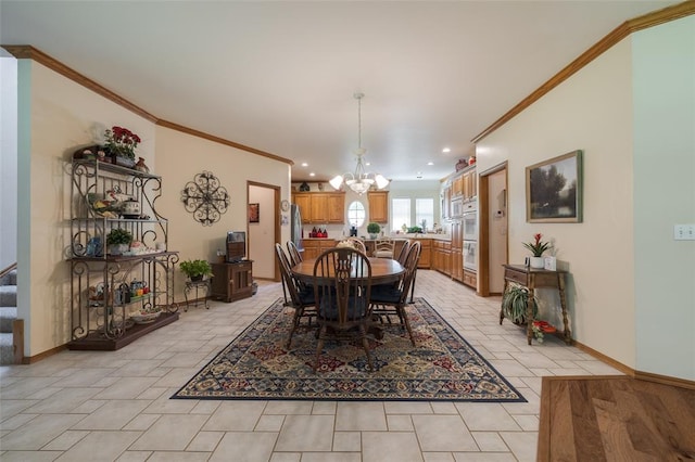 dining room featuring crown molding and a chandelier