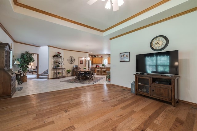 living room featuring light hardwood / wood-style floors and ornamental molding