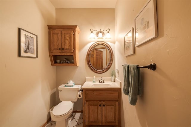 bathroom with tile patterned floors, vanity, and toilet