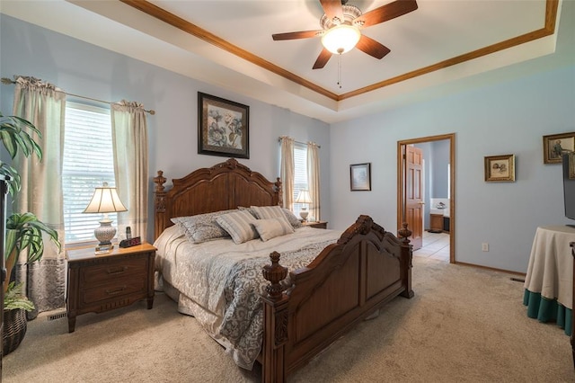 bedroom with connected bathroom, multiple windows, and ceiling fan