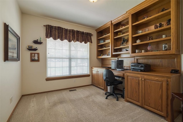 office space with light colored carpet