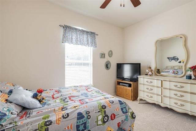 bedroom featuring light colored carpet and ceiling fan