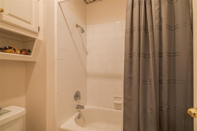 bathroom with toilet and shower / tub combo with curtain