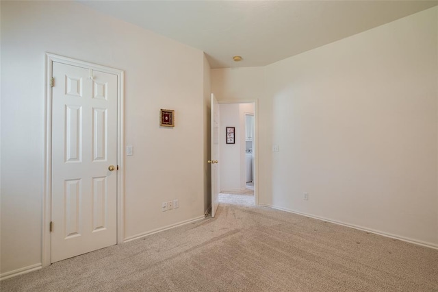 empty room featuring light colored carpet