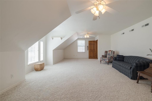 bonus room with light carpet, plenty of natural light, lofted ceiling, and ceiling fan