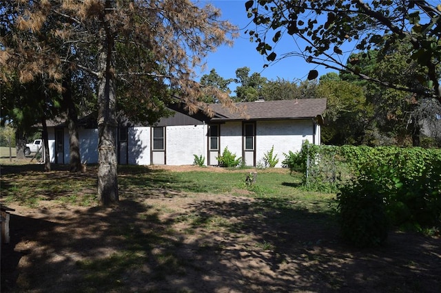 view of home's exterior with a lawn