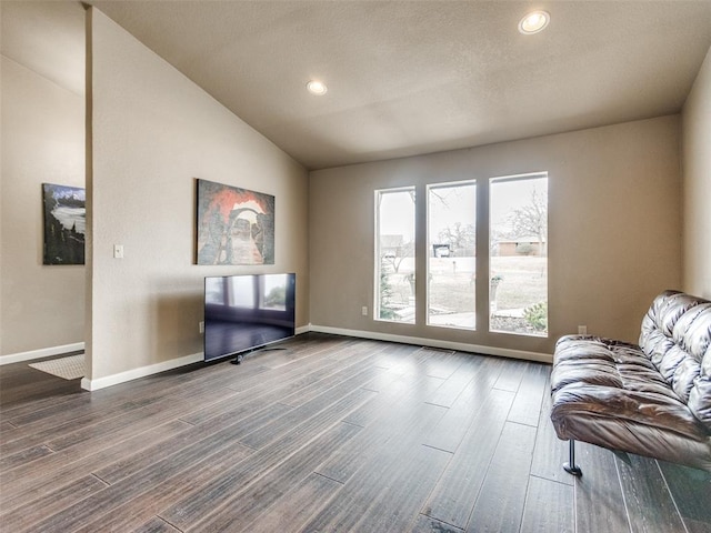 living area featuring dark wood-type flooring, recessed lighting, baseboards, and lofted ceiling