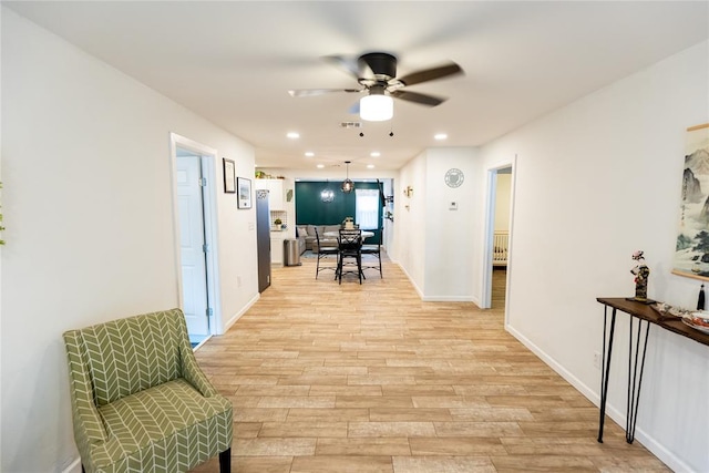 hall with light wood-type flooring