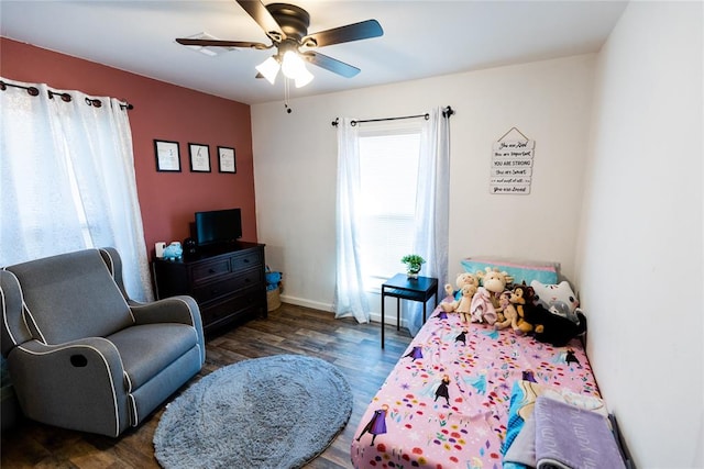 bedroom featuring ceiling fan and dark hardwood / wood-style flooring