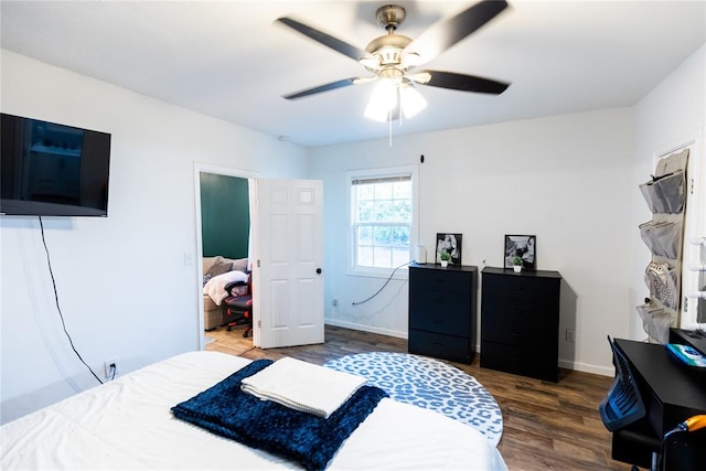 bedroom with ceiling fan and dark hardwood / wood-style flooring