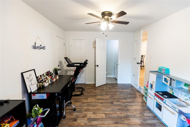 office with ceiling fan and dark hardwood / wood-style floors