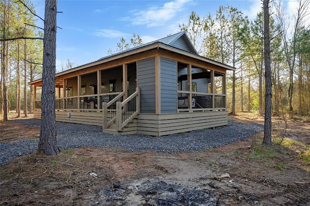 view of property exterior featuring a porch