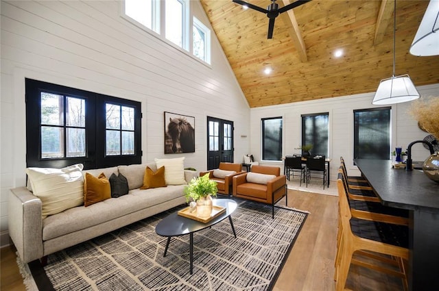 living room with ceiling fan, french doors, high vaulted ceiling, hardwood / wood-style floors, and wood ceiling