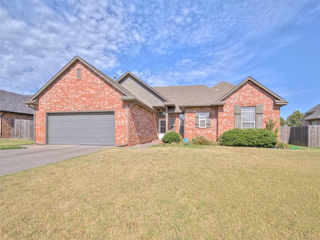 view of front facade featuring a garage and a front lawn