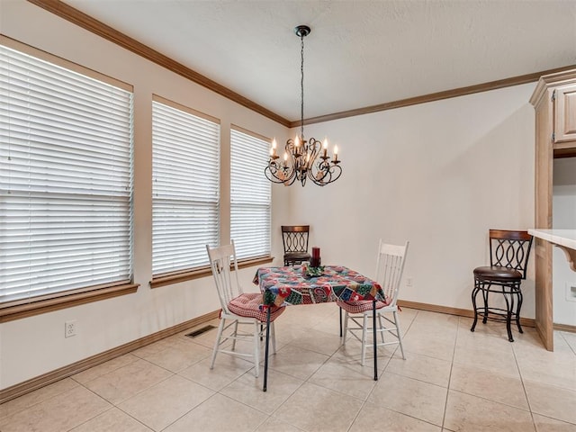 dining room featuring a notable chandelier, light tile patterned flooring, and crown molding