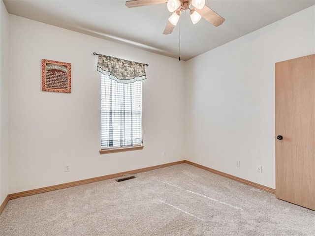 unfurnished room featuring carpet and ceiling fan