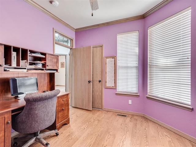 home office featuring light hardwood / wood-style flooring, ceiling fan, and ornamental molding